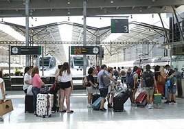 Train passengers at María Zambrano train station.