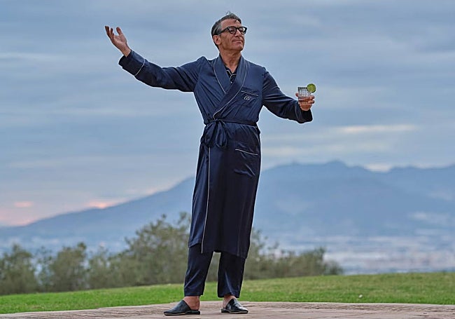 The elegant Cary Grant in his dressing gown, with the coast of Malaga behind him.