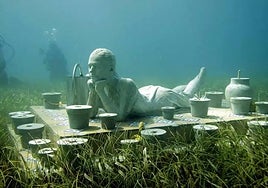 An image of one of the sculptures at the underwater museum in Cancún, Mexico.