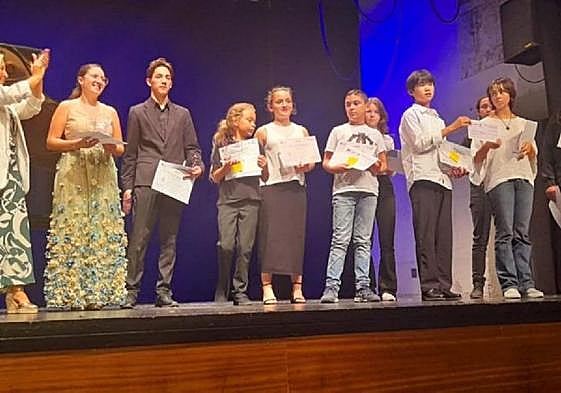 Winners of this year's young musicians competition with Arts Society Nerja Chair, Helen Sijsling (left).