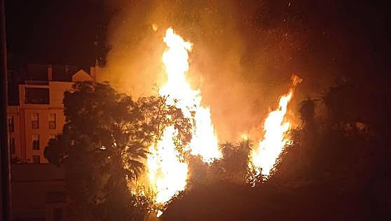 Man rushed to hospital after early-morning blaze on a plot of land in Malaga