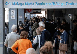 Passengers crowded in a Cercanías commuter train carriage.