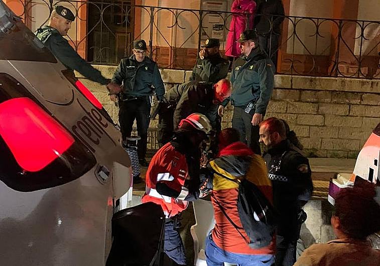 Passengers are helped by the emergency services after exiting the trains.