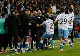 Jokin Gabilondo celebrates his goal with coach Sergio Pellicer.