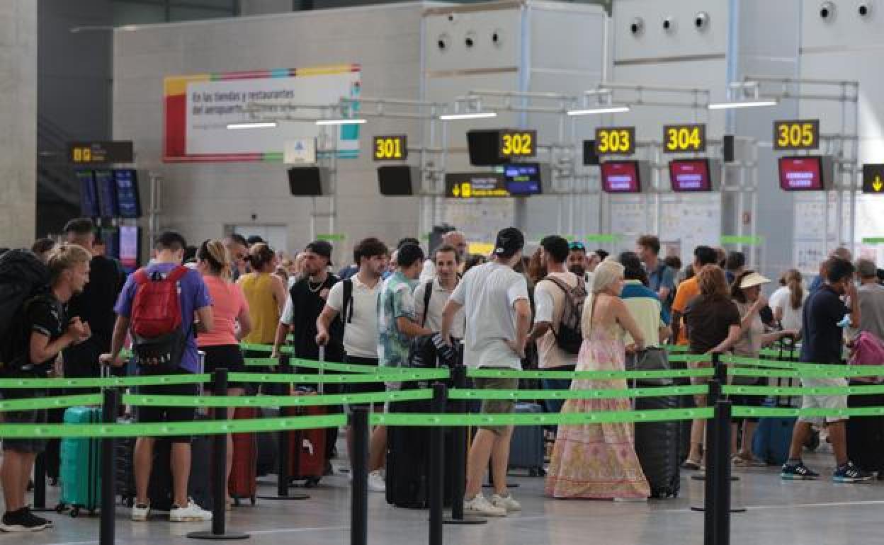 Queues at the check-in counters last August.