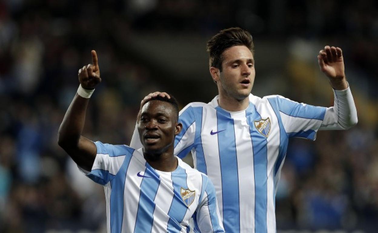 Atsu, left, celebrates a goal during his spell with Malaga.