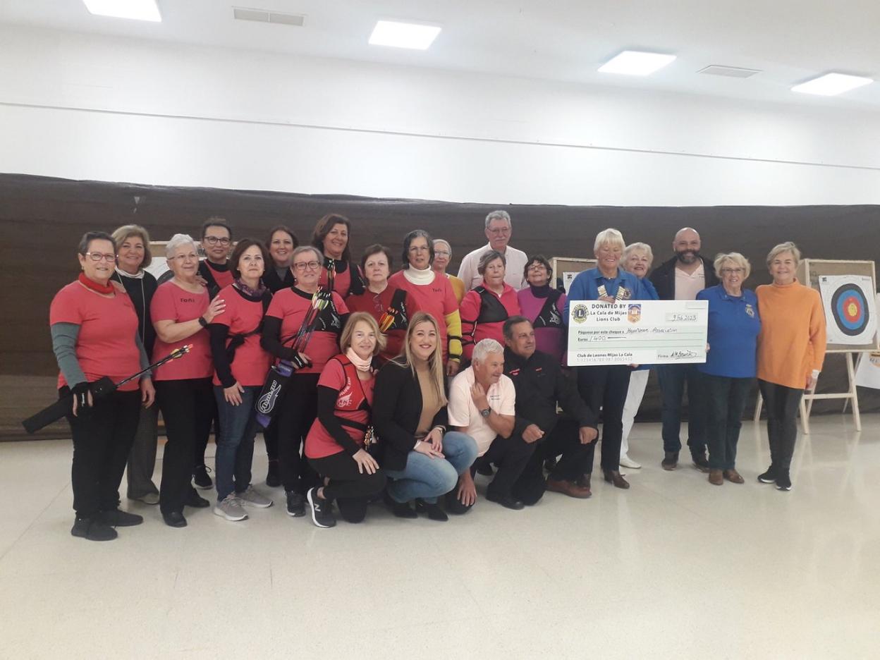 La Cala de Mijas Lions Club and Spanish cancer society members with the women participating in the archery programme in Mijas. 
