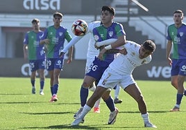 Malaga's Antoñito battles for the ball during this Sunday's clash.