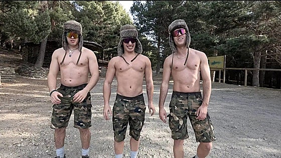 Why did three young men climb the highest mountain on mainland Spain wearing just shorts, boots and hats?