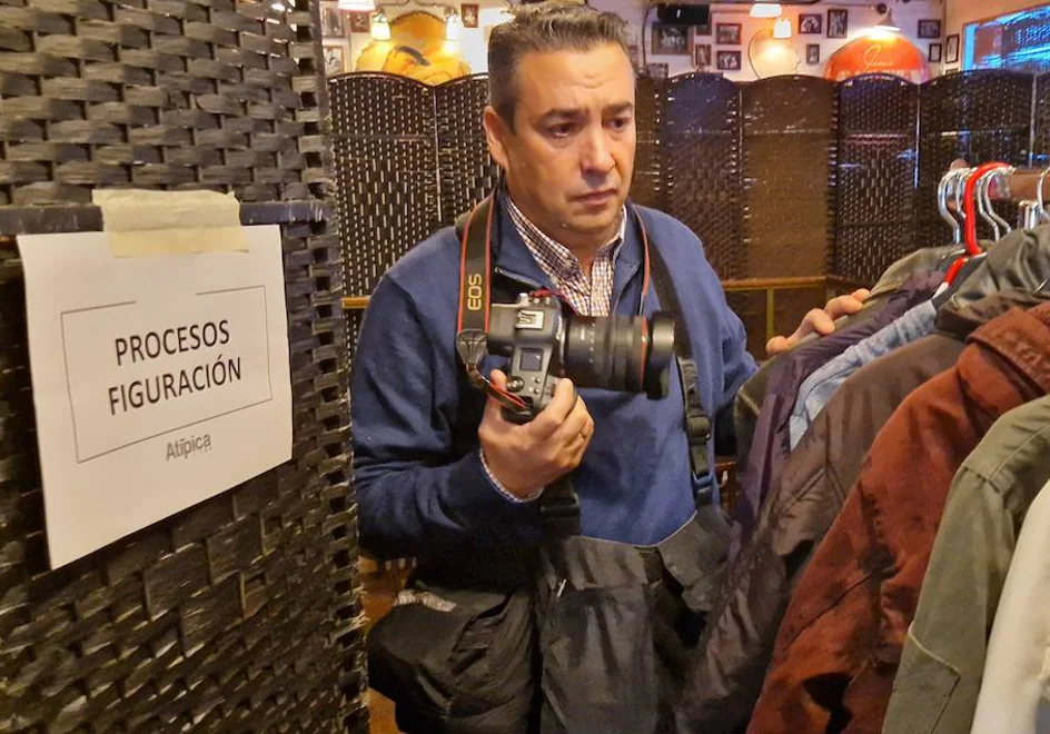 Salvador Salas steps into wardrobe with his camera, as always.
