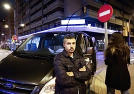 Adrián, the private hire driver with the woman he saved in the background.