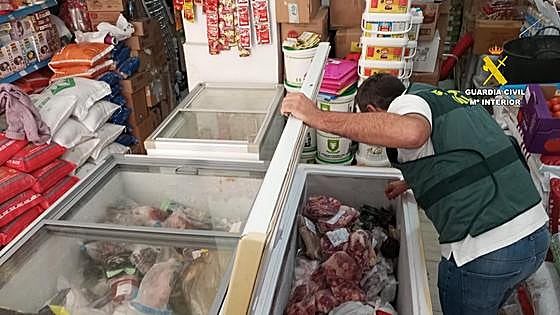 Freezer of horrors at Malaga takeaway: unpackaged chickens next to out-of-date meat