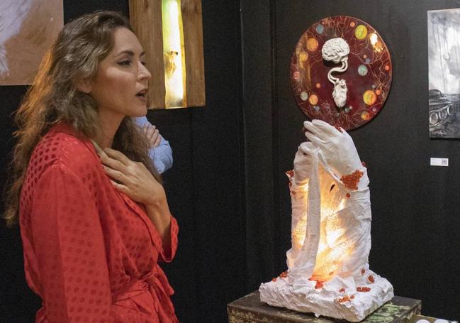 Syrie Jo Blanco Walsh, with her work that pays homage to those who could not receive treatment, due to the widespread collapse of health care.