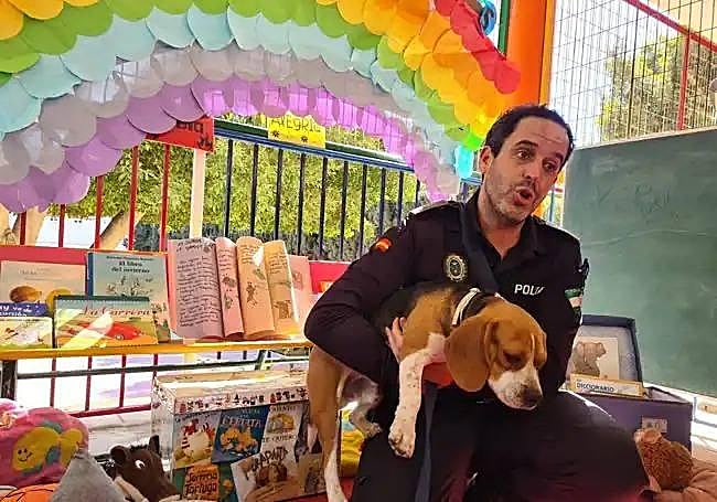Police dog Bobby with his owner.