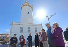 Members of the protest group against the hotel next to the lighthouse.