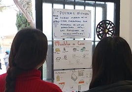 Two students observe one of the projects carried in the temporary adaptation classrooms.