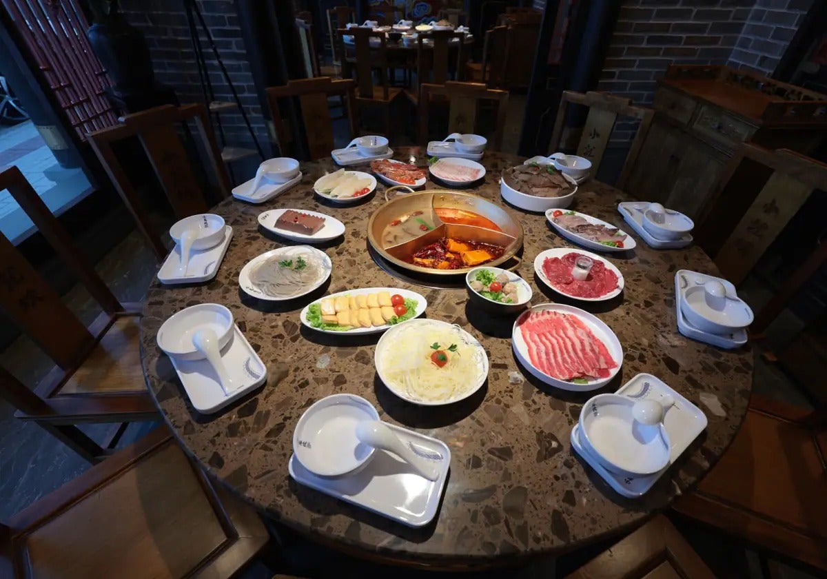 The hot pot ingredients are cooked in the central pot.
