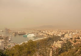 The 'calima' haze shrouds Malaga city today.