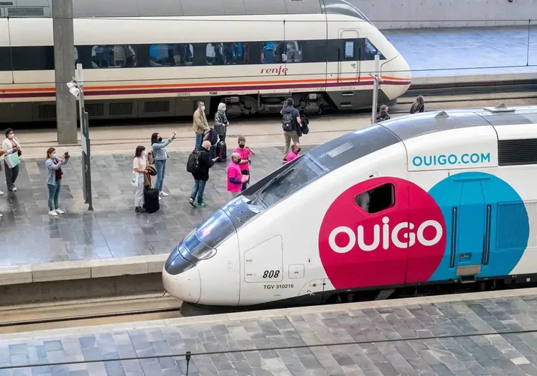 An Ouigo train rolls into a railway station.