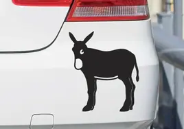 What does the donkey sticker on the back of many cars mean?