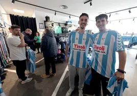 Malaga CF fans proudly wear the new shirt