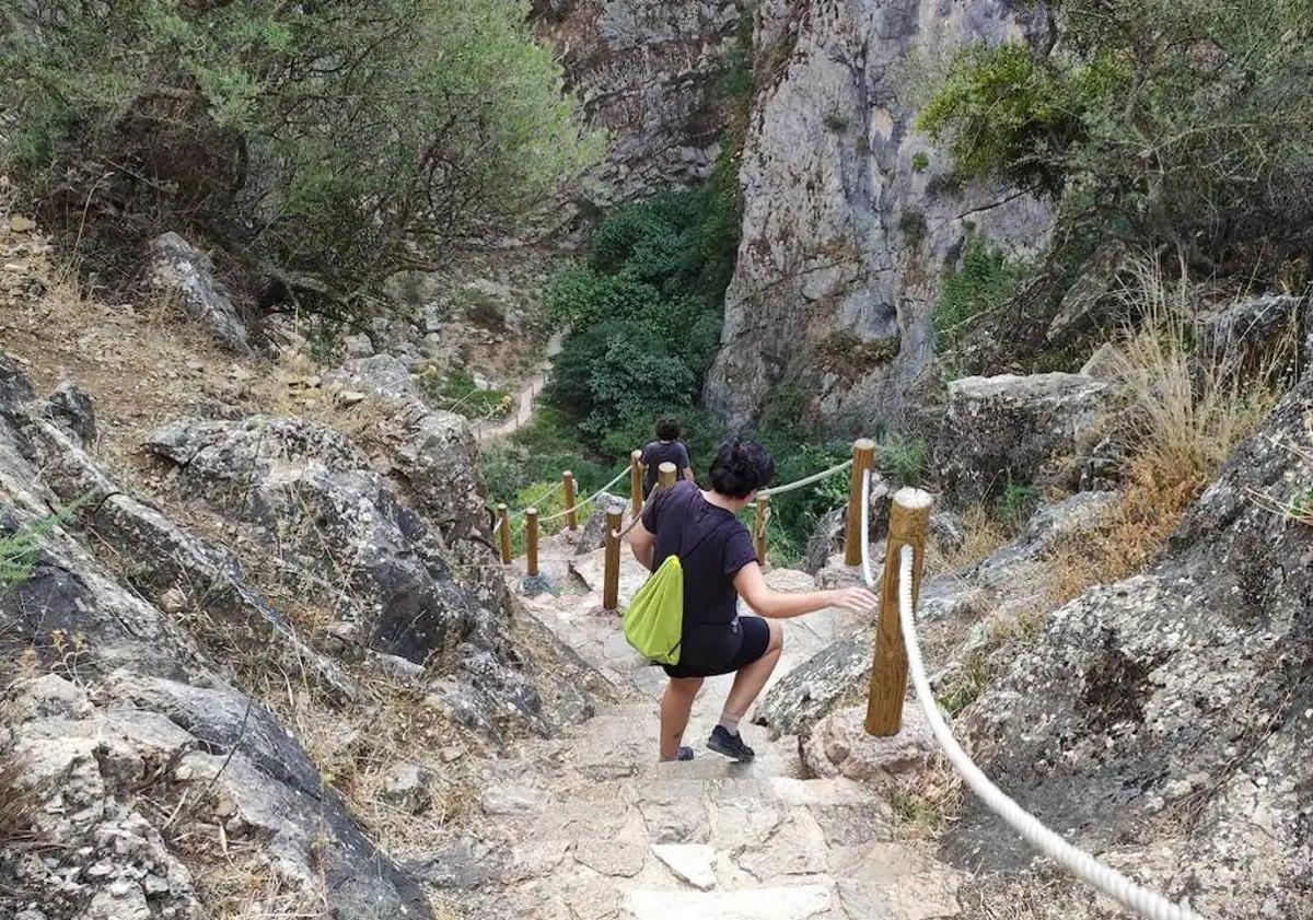 This is the spectacular cave near Ronda with an entrance standing over ...