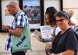 Readers with Castillo's new book while queuing before the launch on Tuesday.