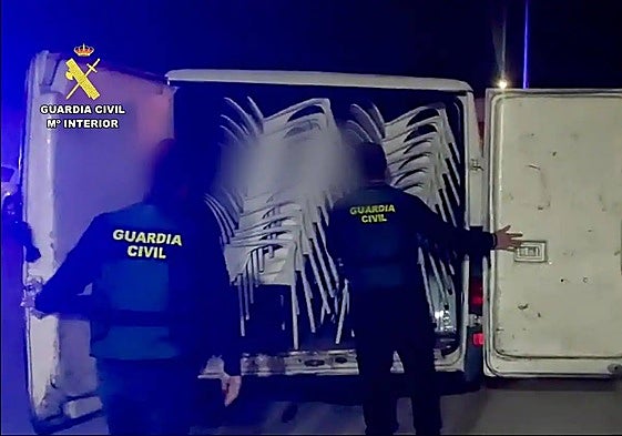 Officers with the stolen chairs.