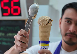 A scoop of turrón-flavoured ice cream in a cone from Casa Mira.