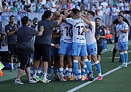 The players celebrated Larrubia's goal with the coaching staff.
