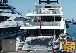 One of the yachts sprayed with paint by activists in Barcelona on Sunday.