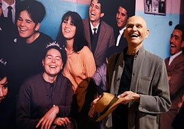 Joel Meyerowitz, in front of the huge, colourful portrait of the Gypsy family who took him in in the 1960s.