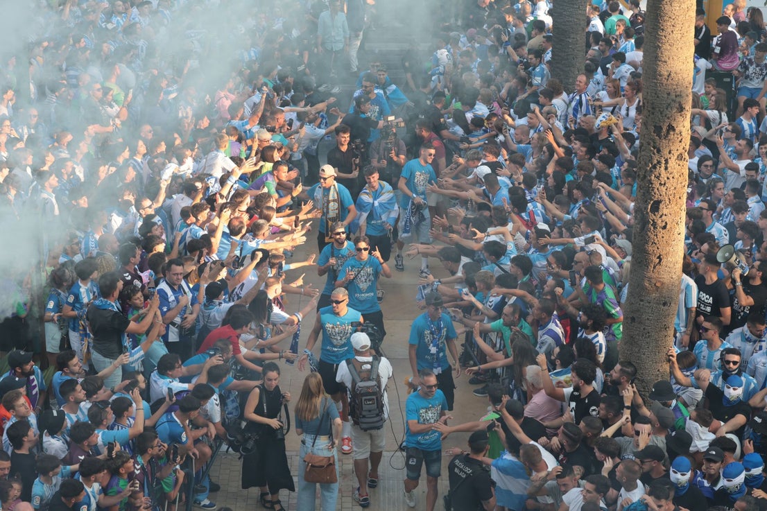 Fans celebrate Malaga CF's promotion as squad take open-top bus tour, in images