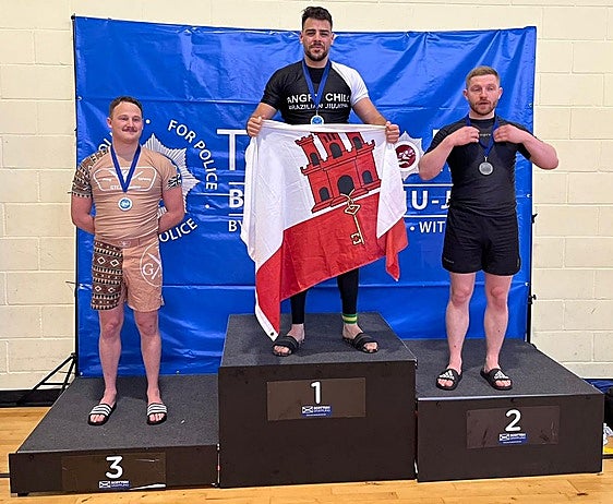 PC Danino on the podium with his gold medal.