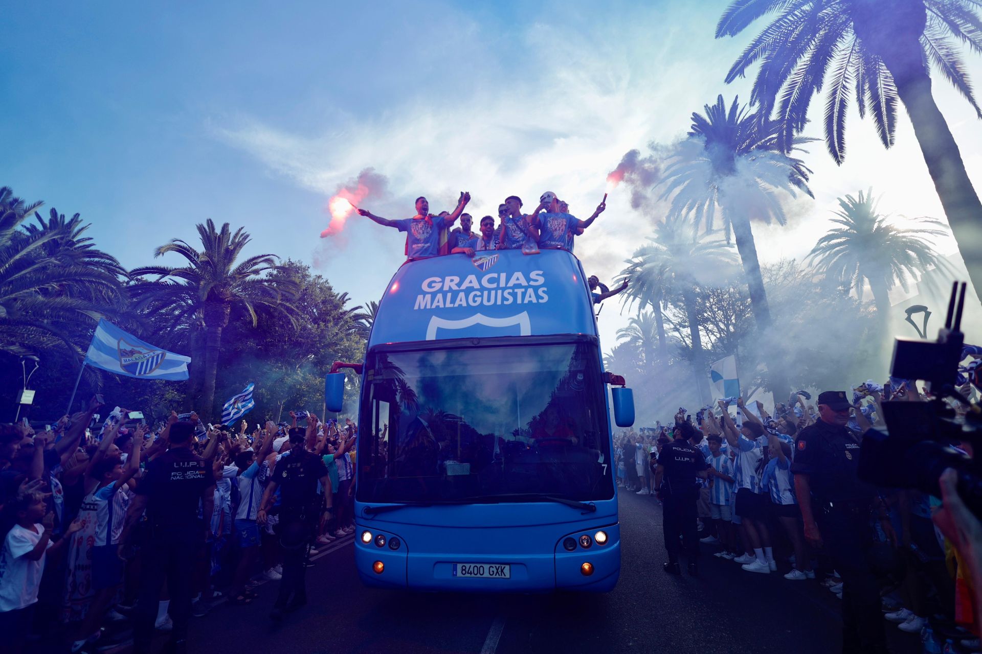 Fans celebrate Malaga CF's promotion as squad take open-top bus tour, in images