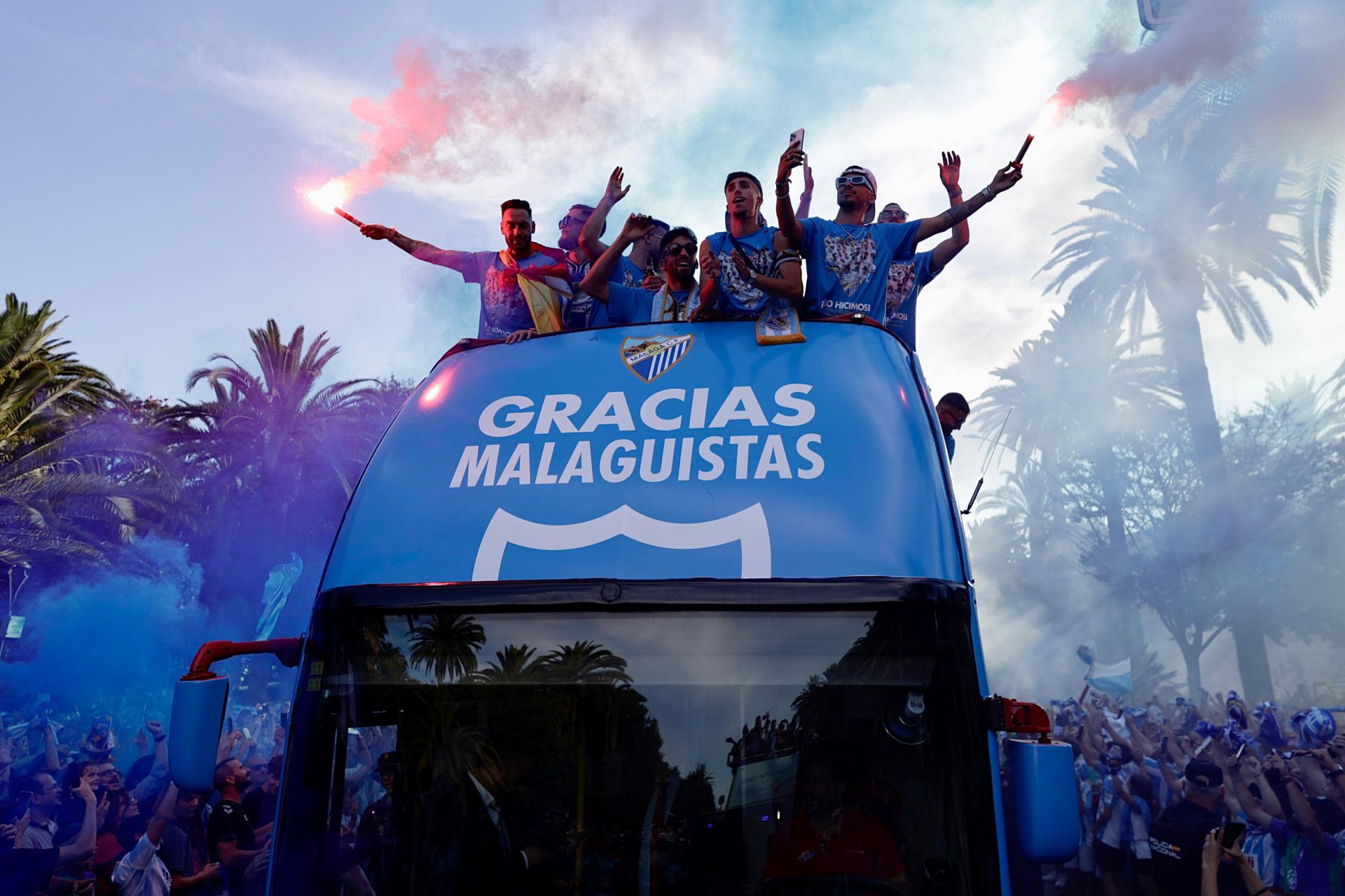 Fans celebrate Malaga CF's promotion as squad take open-top bus tour, in images