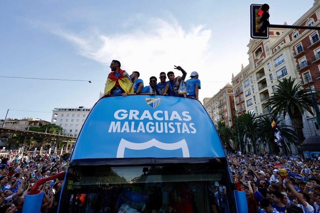 Fans celebrate Malaga CF's promotion as squad take open-top bus tour, in images