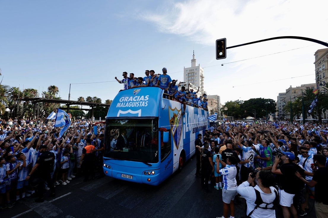 Fans celebrate Malaga CF's promotion as squad take open-top bus tour, in images