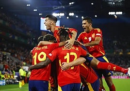 Spain players celebrate one of their goals against Georgia on Sunday.
