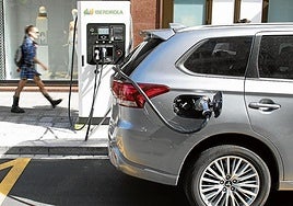 An EV plugged into a charging point.