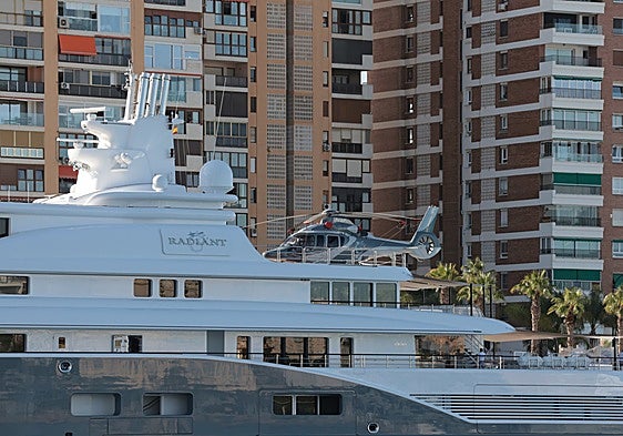 Who owns the 270-million-euro megayacht with a helicopter landing pad that is docked in Malaga port?