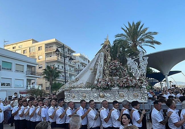The Virgen del Carmen of Estepona carried on her gold and silver throne.