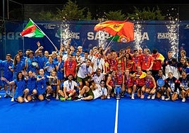 The winners pose with their trophies.