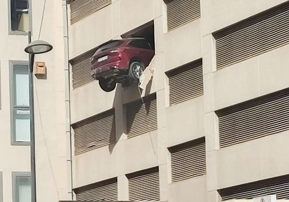 A car was partially suspended in mid-air.