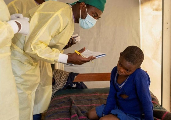 A doctor examines a child with mpox in the Democratic Republic of Congo.