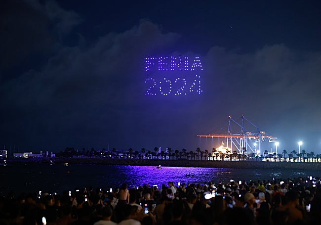 The slogan 'Feria 2024' drawn by the drones in the night sky.