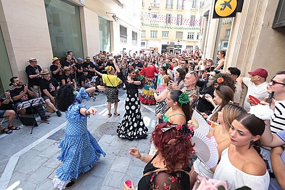 Malaga city centre maintains the essence of 'feria', its traditional summer fair