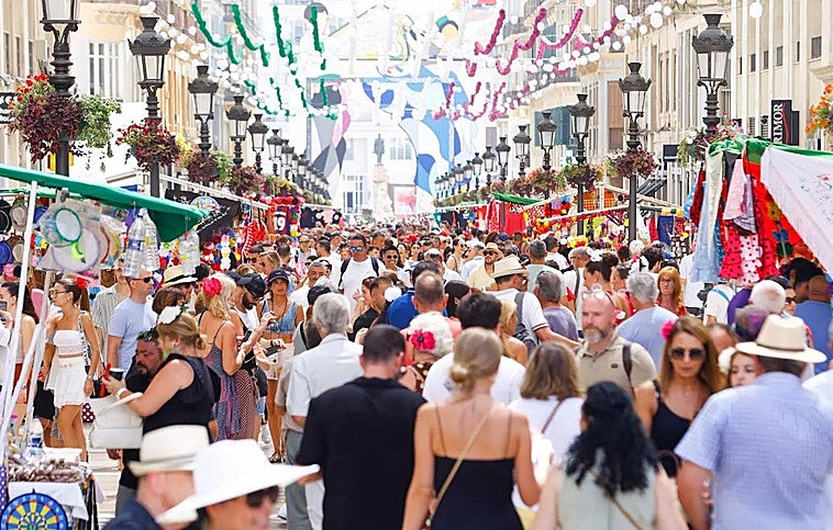 Malaga Feria 2024: Crowds in Calle Larios in the city centre.