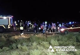 Passengers are helped from the train by the emergency services.