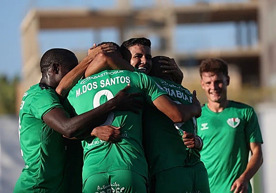 The Antequera players celebrate one of their goals.